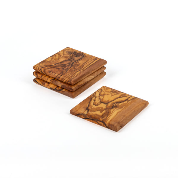 Olive Wood Coaster Set of 4 handcrafted from Mediterranean olive wood – Medolivewood. Sustainable artisan table coasters.