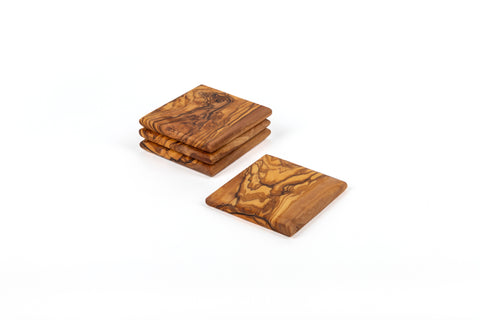Olive Wood Coaster Set of 4 handcrafted from Mediterranean olive wood – Medolivewood. Sustainable artisan table coasters.